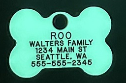 Glow in the dark bone tag shown glowing in the dark
